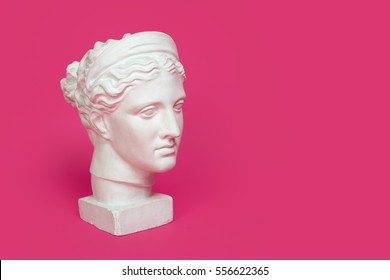 Marble Head Of Young Woman, Ancient Greek Goddess Bust Isolated On Pink Background With Space For Text.