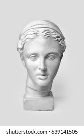 Marble Head Of Young Woman, Ancient Greek Goddess Bust. Sculpture Executed In Accordance With Modern Standards Of Beauty Isolated On White Background