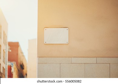 Marble House Nameplate Mock Up On The Corner Of Building In Barcelona, Empty White Space For Number And Text With Street Name On The Wall Background