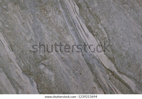 Marble\
pattern on tile floor. Similar to the surface of the moon. Grey\
white and brown color.Close up and zoom texture. Rough surface on\
floor. Free style and natural of stone\
pattern.