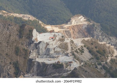 Marble quarry on the Apuan Alps with cranes.