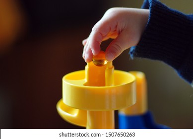 Marble Run And A Childs Hand