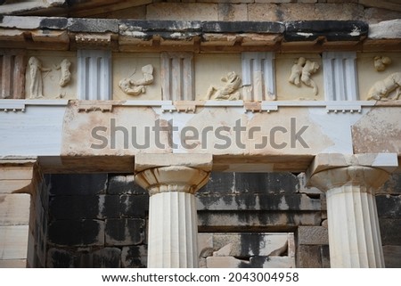Marble sculpted triglyph and metope of the Doric order Athenian Treasury a historic monument at the sacred archaeological site of Delphi in Phocis, Greece. 