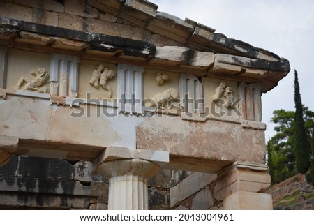 Marble sculpted triglyph and metope of the Doric order Athenian Treasury a historic monument at the sacred archaeological site of Delphi in Phocis, Greece. 