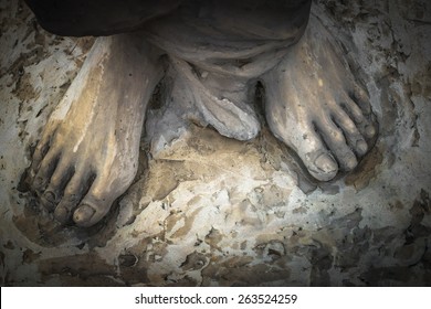Marble sculpture depicting Jesus' feet.