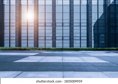   Marble square in front of glass curtain wall of modern city high-rise building, Shanghai