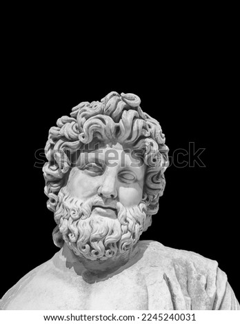 Marble statue of Asclepius, the god of medicine. Roman statue, II century AD. Isolated, monochrome, black background. Copy space, close up. Healthcare or history and art concept