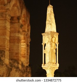 Marble Statue Outside The Arena Di Verona At Night. Selective Focus