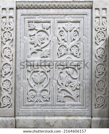 Marble stone carving with geometric, floral and bird motifs. Handmade. marble texture. Byzantine motifs in the decoration of Orthodox churches.