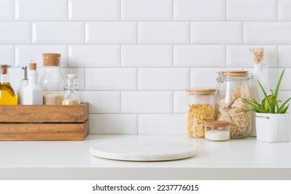 Marble stone stand on kitchen table with various food ingredients - Shutterstock ID 2237776015