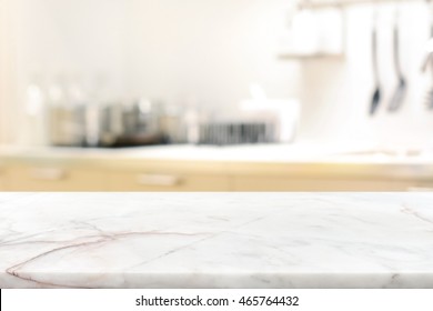 Marble stone table top (kitchen island) on blur kitchen interior background - can be used for display or montage you products