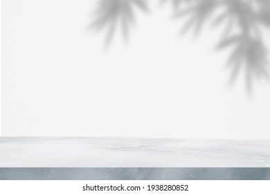 Marble Table With Leaf Tree Bamboo Shadow On Concrete Wall For Texture Background. Product Display, Mockup.


