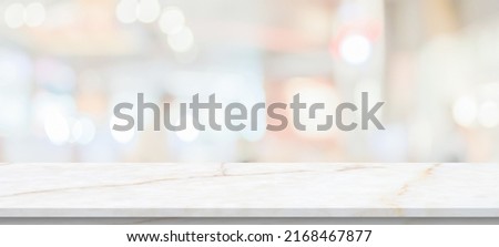 marble table top with blurred kitchen cafe restaurant interior background