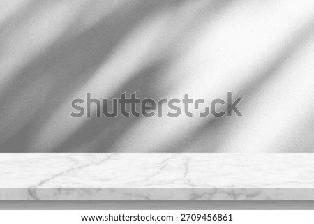 Marble table with tree shadow drop on white wall background for mockup product display