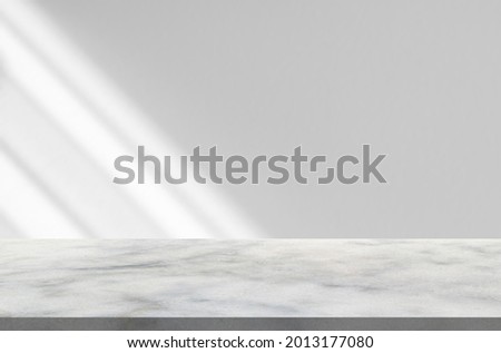 Marble table with window shadow drop on white wall background for mockup product display