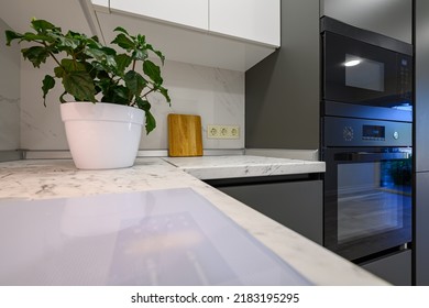 Marble Worktop Of Modern White And Dark Grey Kitchen