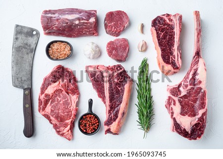 Similar – Dry aged raw tomahawk beef steak isolated on white background