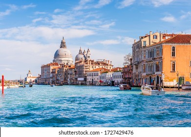 March 06, 2014: The Grand Canal and its facades and the Basilica of Santa Maria della salute in the background in Venice in Veneto, Italy