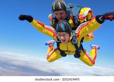 March 1, 2013. Toledo, Spain. An instructor and a female student jump tandem parachutes on a cold day in Spain.