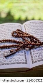 March 10,2022, east Java - Indonesia : close up adn selective focus, holy quran with wooden tasbih
