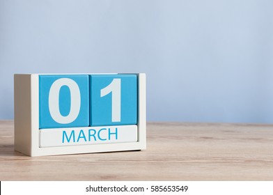 March 1st. Day 1 of month, wooden color calendar on table background. Spring time, empty space for text