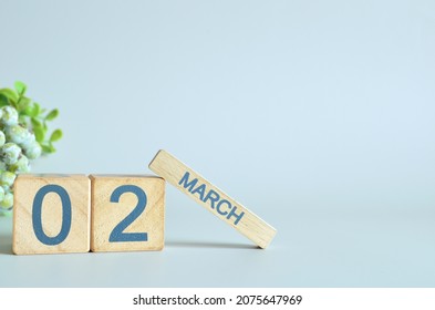 March 2, Calendar Cover Design With Number Cube With Green Fruit On Blue Background.