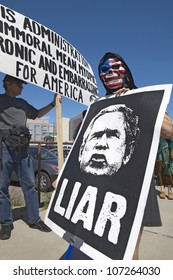 MARCH 2005 - Three Protestors In Tucson, AZ Of President George W. Bush Is Holding A Sign Proclaiming Bush Is A Liar Regarding The Iraq War