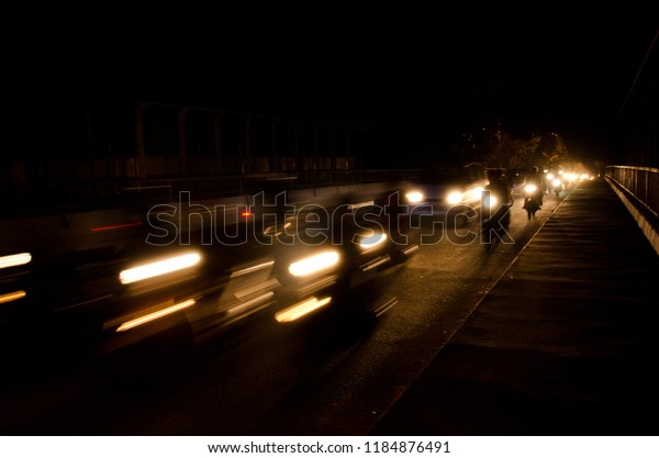 March 2014, the atmosphere of the\
vehicle lights at night on the streets of Jakarta,\
Indonesia.