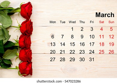 March 2017 calendar with red roses on white desk - Powered by Shutterstock