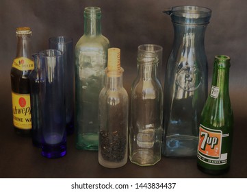 A soft and muted horizontal presentation of old dusty bottle, including an ...