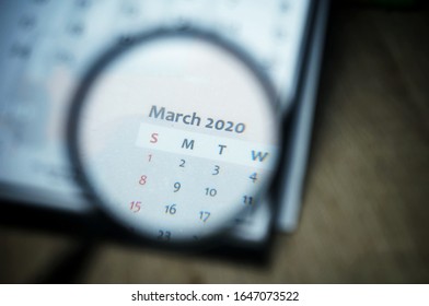 March 2020 Calender Under Magnifying Glass. Selective Focus.