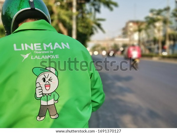 march ,2020 :Line man . food delivery by\
motorcle at bangkok\
thailand