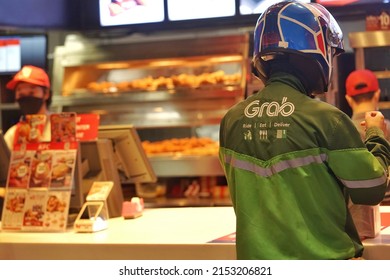 March ,2022 :Grab Food Or Grab Bike . Food Delivery By Motorcycle At Kfc , Bangkok Thailand