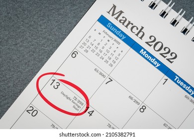 March 2022, spiral desktop calendar with the start of daylight saving time marked in red, business and time concept - Shutterstock ID 2105382791