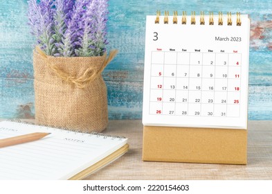 March 2023 Monthly desk calendar for 2023 year with wooden pencil and diary. - Shutterstock ID 2220154603