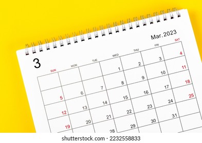 March 2023 Monthly desk calendar for 2023 year on yellow background.