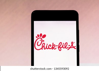 March 21, 2019, Brazil. Chick-fil-A logo on the mobile device screen. Chick-fil-A is an American fast food system known not to open for service on Sundays.