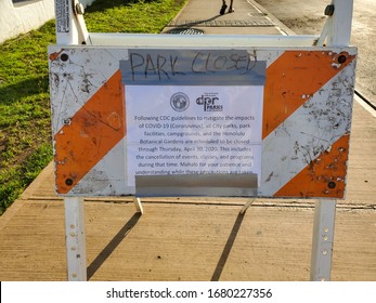 March 22, 2020, Ala Moana Beach Park, Oahu, Hawaii : Park Closed sign with information posted from the City & Country of Honolulu at Ala Moana beach park for protection Coronavirus spreading.