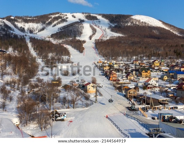 March 23, 2022, Mountain Air Resort,\
Yuzhno-Sakhalinsk, Russia: bird\'s-eye view of the ski lift, resort\
and Bolshevik Mountain.