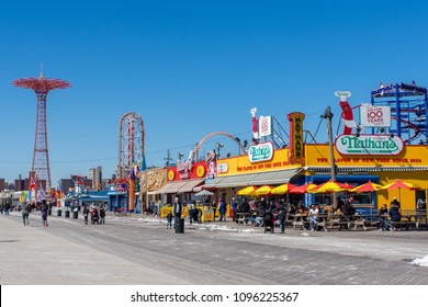 March 24, 2018: Iconic Boardwalk With Parachute Drop And Nathans Hot Dogs In Coney Island, Brooklyn