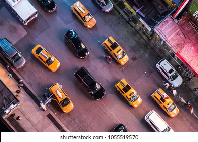 March 24th, 2018. Times Square, New York City, NY, USA- Amazing bird's eye view of Times Square, New York City at night showing all the car traffic and pedestrian activity in the center of the world. 