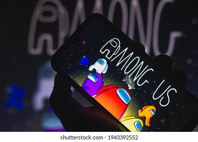 March 25, 2021, Brazil. In this photo illustration a Among Us logo seen displayed on a smartphone. Among Us is an online electronic game, of the group game and survival genres