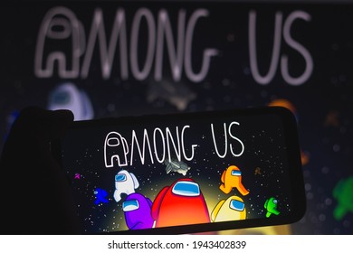 March 25, 2021, Brazil. In this photo illustration a Among Us logo seen displayed on a smartphone. Among Us is an online electronic game, of the group game and survival genres