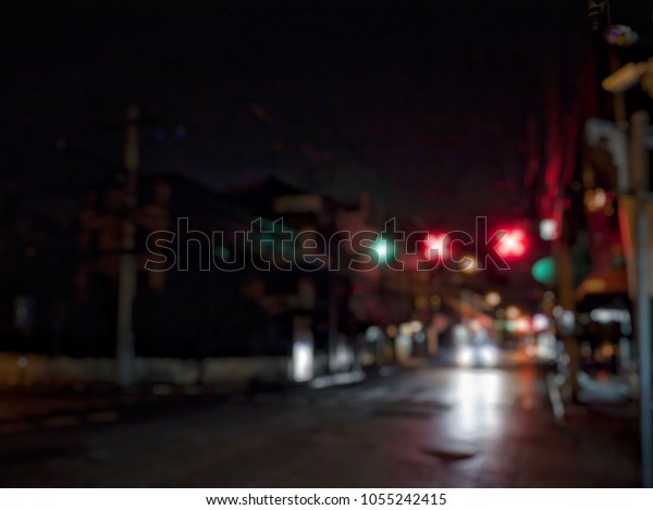March 27, 2018 Bangkok Thailand,\
Blurred of Focus Bangkok night street with light traffic\
sign