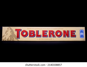 March 27, 2022 Ukraine City Kyiv Toblerone Bars Swiss Milk Chocolate Of Switzerland, On Dark Background