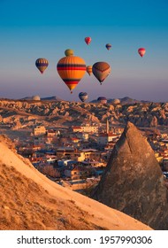 March 29, 21 Goreme Cappadocia Turkey hot air balloons fly at sunrise over the mountains 