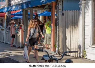 March 2nd 2022 Key West Florida United States - Tourists Walk By Stores And Bars In Downtown Key West, Florida. 