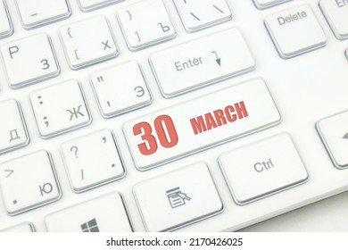 March 30th. Day 30 Of Month, Calendar Date. Cropped View Of Modern White Computer Keyboard With Calendar Date. Concept Workspace, Freelance, Deadline.  Spring Month, Day Of The Year Concept