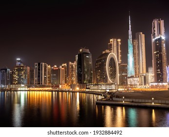 March 5th,2021, Dubai,UAE. Beautiful view of the illuminated sky scrapers along with Burj khalifa captured from the Marasi drive at the Business bay district, Dubai, UAE.