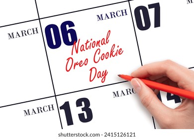 March 6. Hand writing text National Oreo Cookie Day on calendar date. Save the date. Holiday.  Day of the year concept.